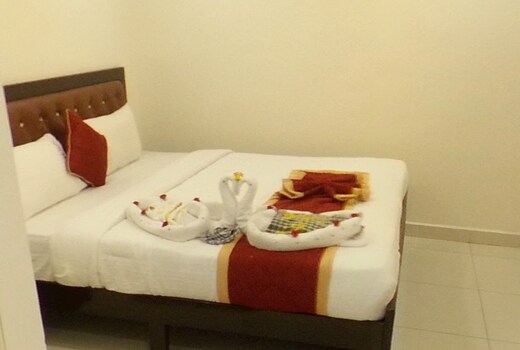MakeMyTrip photo of the Suite Room with king bed and extra mattresses